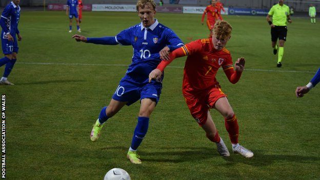 Wales' Sam Pearson competes for possession