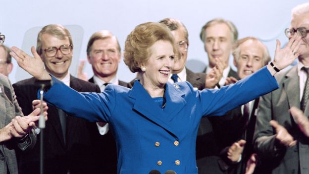 Margaret Thatcher surrounded by male colleagues at the 1989 party conferences