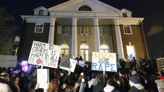 Protesters gather outside the fraternity house where the alleged gang rape featured in the now-debunked article took place.