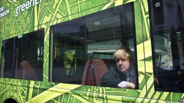 Boris Johnson on a green bus