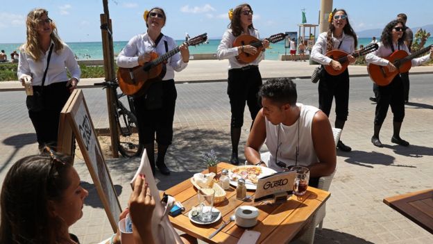 Spanish street musicians perform along the Ballermann stretch on 27 July 2017 in Palma de Mallorca, Spain