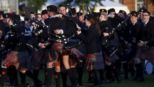 Members of the Shotts and Dykehead Pipe Band react to winning the annual World Pipe Band Championships