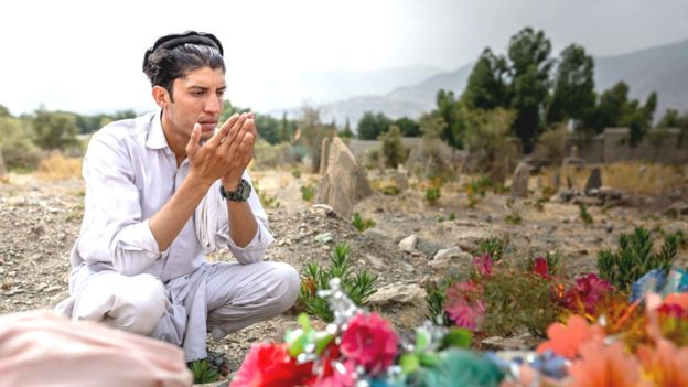 Nematullah at the unnamed soldier's grave