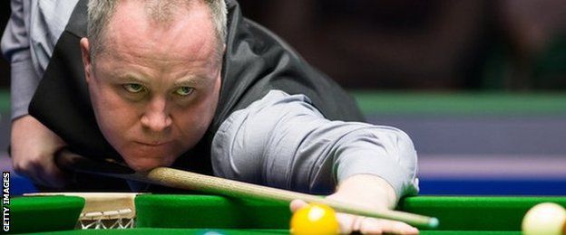 John Higgins plays a shot at the recent UK Championship