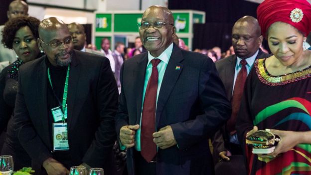 South African President Jacob Zuma (C) takes his seat during a presidential Gala dinner at the Nasrec Expo Centre in Johannesburg on December 15, 2017