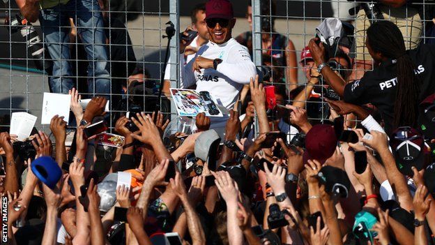 Lewis Hamilton meets fans after the race