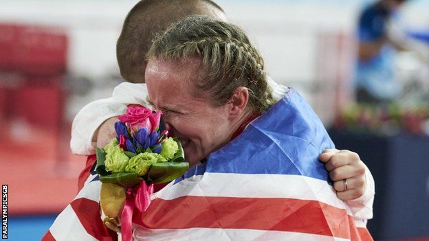 Neil and Lora Fachie embrace after their medal ceremonies