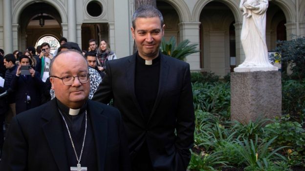 Vatican investigator Maltese archbishop Charles Scicluna (L) and fellow papal envoy Jordi Bertomeu at the Catholic University of Chile, in Santiago on June 13, 2018