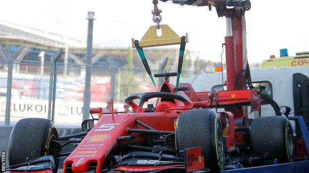 Lewis Hamilton's Ferrari is towed away