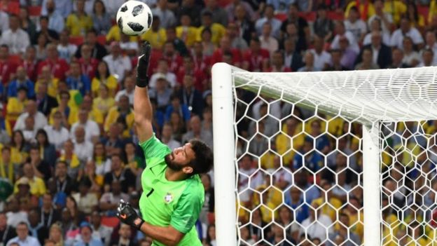 Brazilian goalkeeper Alisson making a save