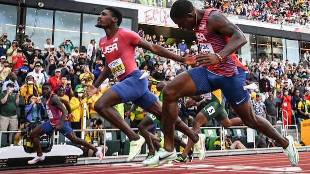 USA's Fred Kerley (centre) crosses the finish line ahead of compatriots Trayvon Bromell (left) and Marvin Bracy (right) to win the men's 100m final