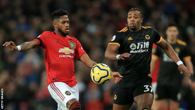 Manchester United midfielder Fred (left) and Wolves winger Adama Traore (right) challenge for the ball during a Premier League match