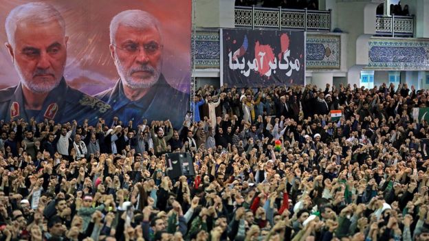 Image shows Iranians gathered for Friday prayers in the capital Tehran, under portraits of Qasem Soleimani