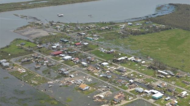 Flood waters surround buildings as seen from a U.S. Coast Guard overflight to survey post Hurricane Laura damage in Lake Charles, Louisiana, U.S. August 27, 2020.