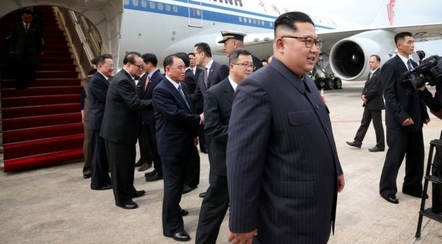 Kim Jong-un walking off his plane in Singapore