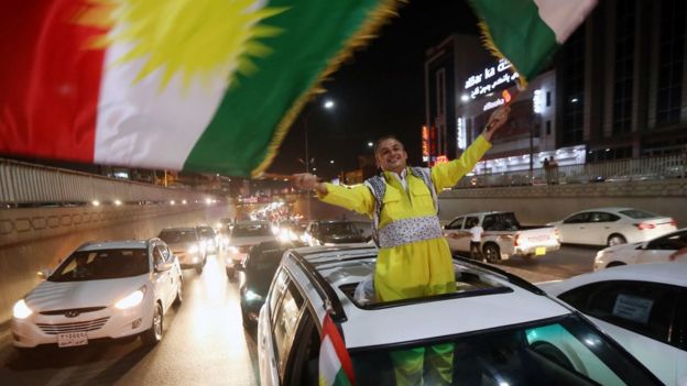An Iraqi Kurdish man waves Kurdish flags as after the result of the independence referendum was declared in Irbil on 27 September 2017