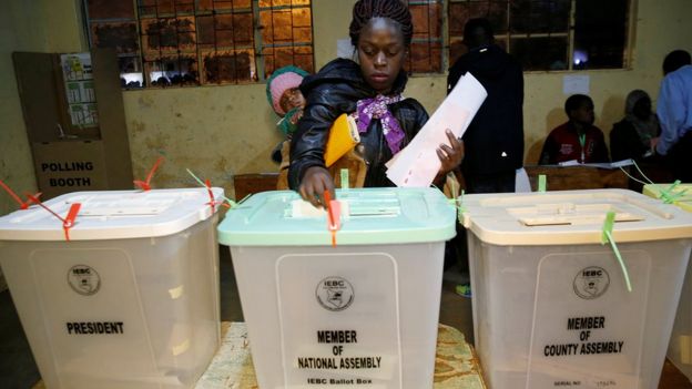 Woman casts her vote at a polling station during the presidential election in Kibera, Nairobi, Kenya August 8, 2017