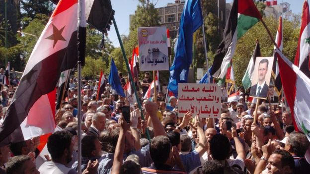 Government supporters take part in a rally in Suweida on 10 June 2020