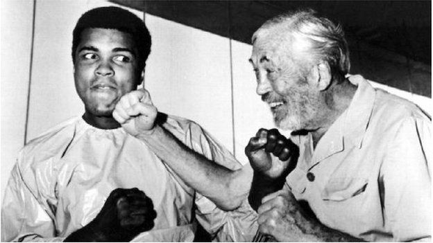 Ali in playful mood with film director John Huston