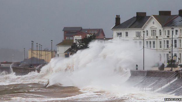 Waves crashing onto the promenade on Exmouth seafront