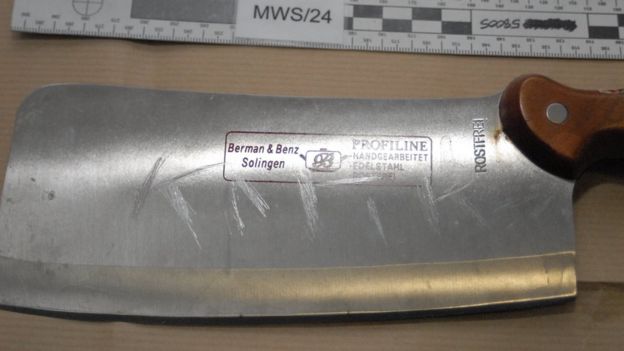 Meat cleaver with the word Kafir scratched on it
