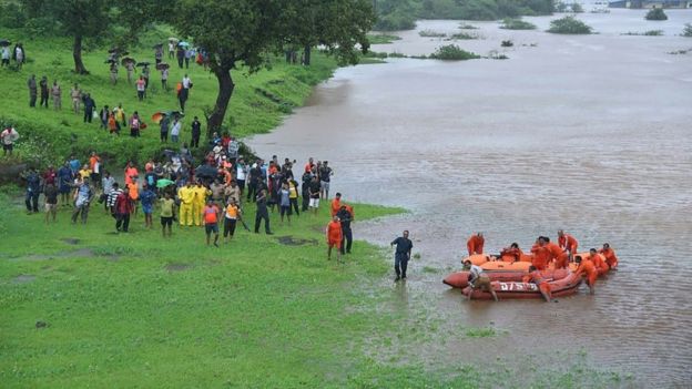 Members of the National Disaster Resoponse Force (NDRF) rescue stranded passengers