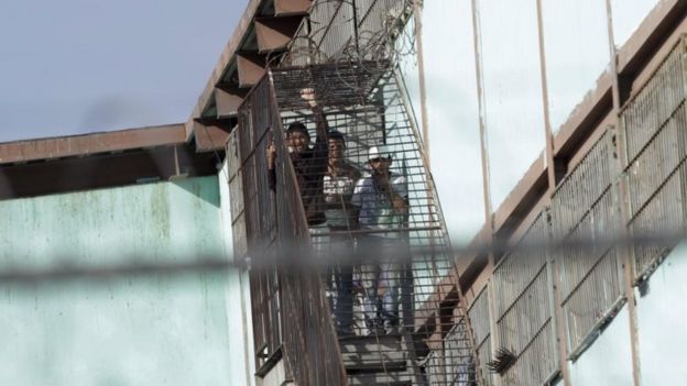 Inmates look from a staircase at the Topo Chico prison in Monterrey, Mexico on 11 February, 2016