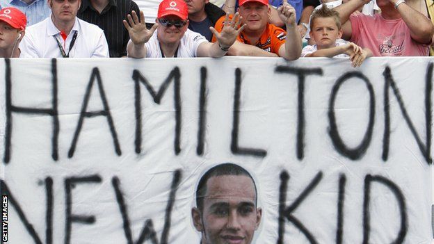 McLaren fans with a Lewis Hamilton sign