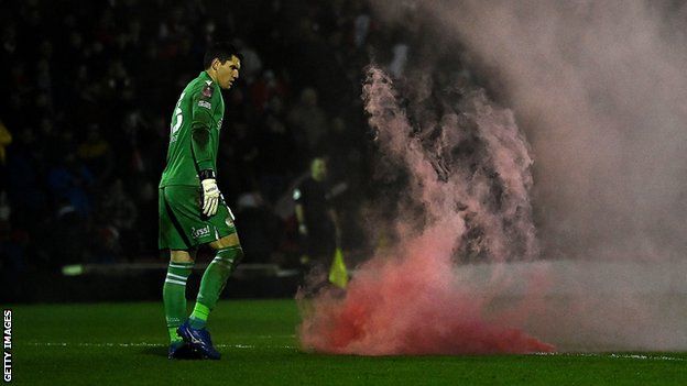 Flares were thrown onto the pitch during Kidderminster's win over Championship side Reading