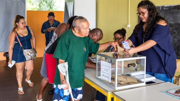 A man casts his ballot for second round of the French presidential election at a polling station in Bellevue, French Guiana, on May 6, 2017