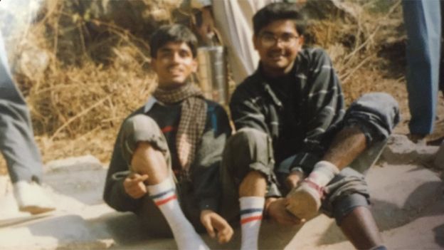 Ambarish Mitra (right) with a friend when he lived in a slum