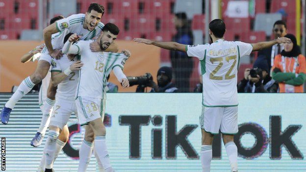 Algeria's players celebrate during the semi-final win against Niger