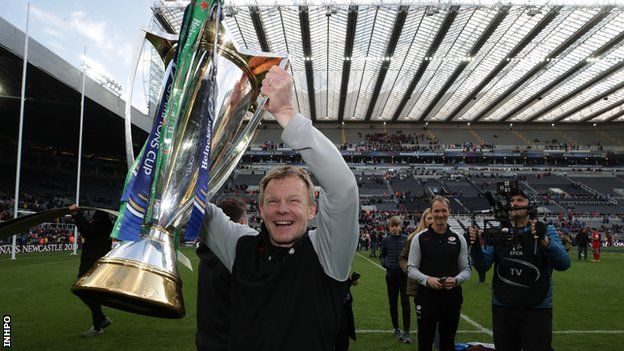 Mark McCall lifts the European Champions Cup trophy