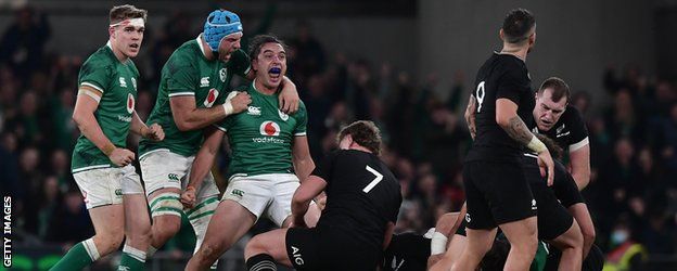 Ireland's James Lowe celebrates with team-mates