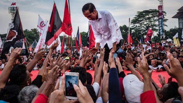 Indonesian incumbent Presidential candidate Joko Widodo, is greeted by his supporters at the Sriwedari stadium during election campaign rally on April 9, 2019 in Solo, Central Java, Indonesia.