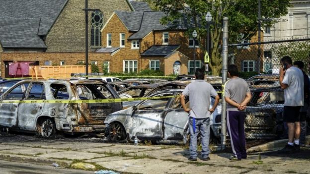 The remains of vehicles set alight amid unrest in Wisconsin over the shooting of an unarmed black man