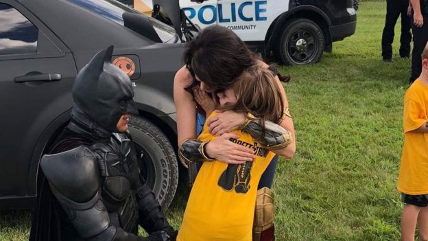 Batman, Wonder Woman and Garrett's sister at the Celebration of Life