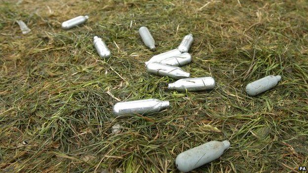 Discarded laughing gas canisters at a music festival