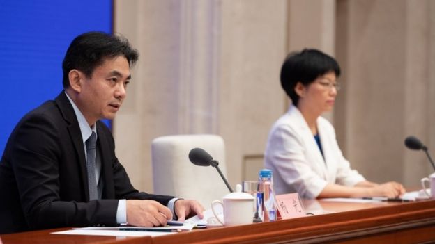 Spokespersons of the Hong Kong and Macau Affairs Office of the State Council, Yang Guang (L) and Xu Luying (R)