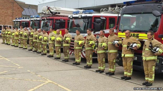 Firefighters from West Sussex Fire and Rescue service observed a minute's silence