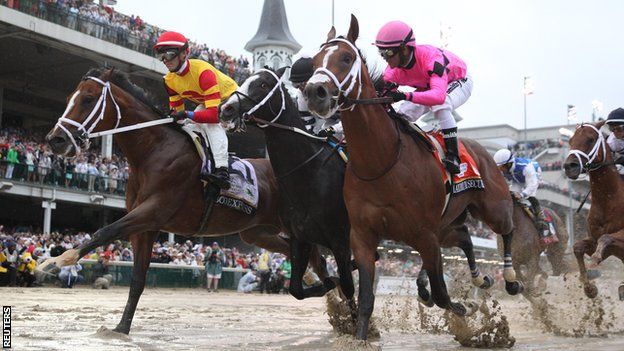 Chris Landeros aboard Bodexpress (left) races Luis Saez aboard Maximum Security (right) during the 145th running of the Kentucky Derby at Churchill Downs.