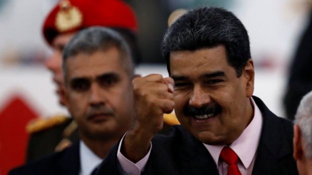 Nicolás Maduro gestures as he leaves after receiving a certificate confirming him as the winner of Sunday's election in Caracas, 22 May