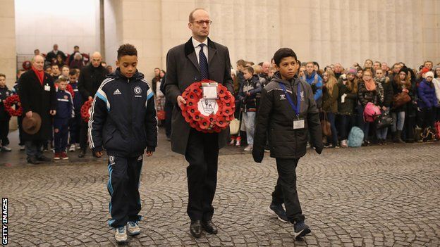 Jamal Musiala of Chelsea, Max von Olenhusen - the great great grandson of the German officer who called the Christmas day truce - and Seb Losa of Liverpool lay a wreath during the Menin Gate Ceremony on December 12, 2014 in Ypres, Belgium