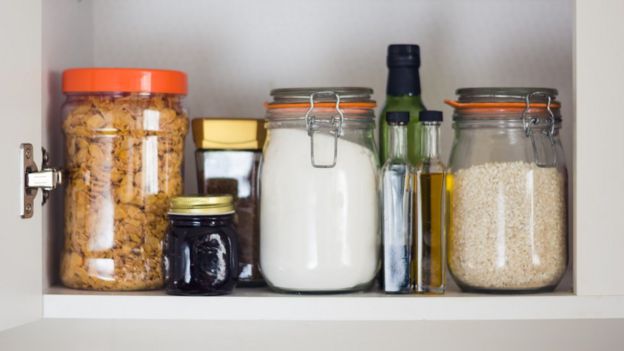 Image shows food including jam, cereal and rice in a cupboard
