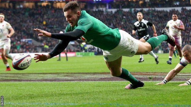Jacob Stockdale scores Ireland's third try in the win over England despite Mike Brown's efforts