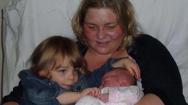 Kate Buckland with her daughters
