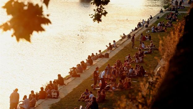 People relaxing along the river in Toulouse