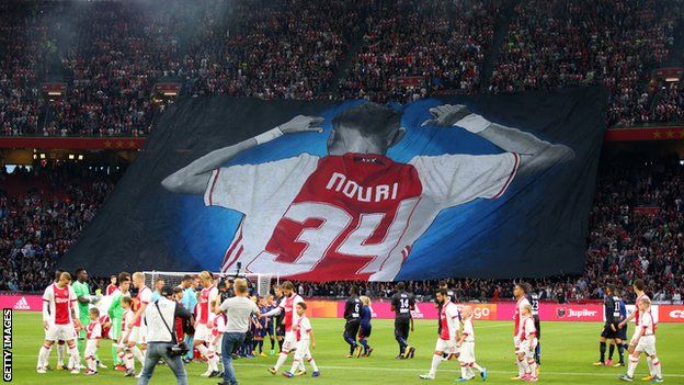 Ajax fans display a giant banner in support of Abdelhak Nouri of Ajax before the UEFA Champions League Qualifying Third Round match between Ajax and OSC Nice at Amsterdam Arena on August 2, 2017 in Amsterdam