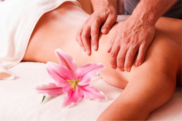Woman receives a massage.