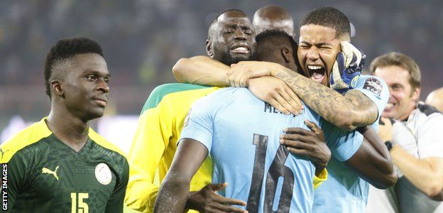 Seny Dieng celebrates Senegal winning the Africa Cup of Nations with Edouard Mendy